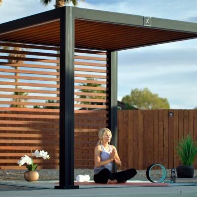 Cabana X with a wood slat privacy wall beside a fence