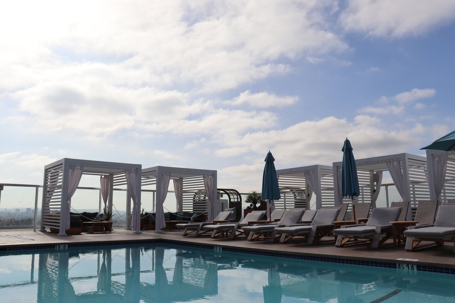 Cabana X cabanas around a rooftop pool