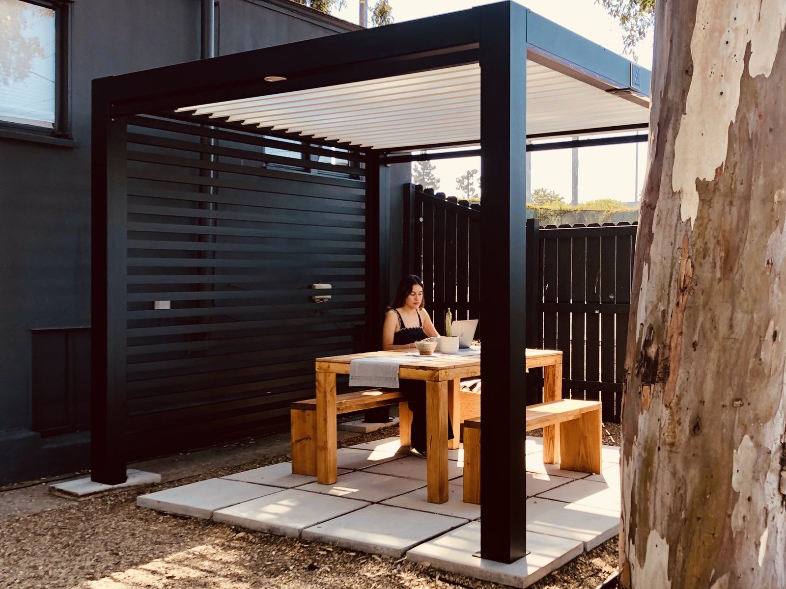 Black Cabana X with a slat wall over a dining table