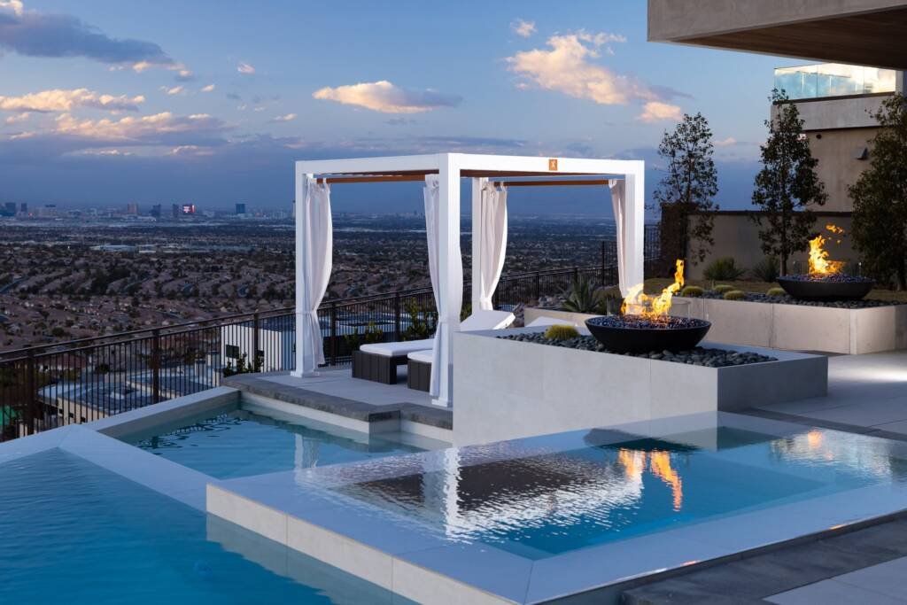 White Cabana X beside a rooftop pool with a city view